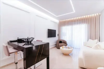 a living room with a black desk and a couch at N K Suite - Design Boutique Stay with City view in Athens