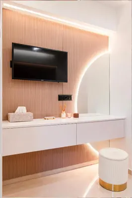 a living room with a tv on a wall at N K Suite - Design Boutique Stay with City view in Athens