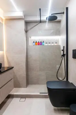a bathroom with a shower with a black toilet at N K Suite - Design Boutique Stay with City view in Athens