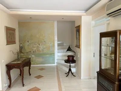 a living room with a painting on the wall at Summer villa Levon in Lagonissi