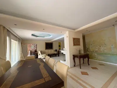 a living room with a couch and a table at Summer villa Levon in Lagonissi