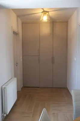 an empty room with a large closet with a light at Athenean Coastal Getaway in Athens