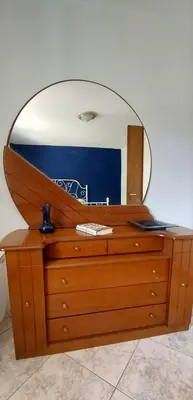 a dresser with a mirror on top of it at 1 Bed Apartment near the beach in Aghia Marina