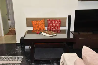 two pillows on a couch in a living room at Your Ideal Retreat in the Heart of Kallithea in Athens