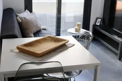 a wooden cutting board sitting on top of a table at Athenean Porto Piraeus Suites -A1 in Piraeus
