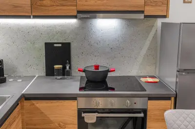 a kitchen with a pot on top of a stove at Urban Nest 1 in Athens