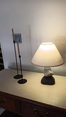 a table with a lamp and a light on it at Adorable apartment in Athens