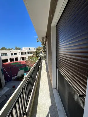 a metal garage door on the side of a building at The Kallimarmaro Nest in Athens