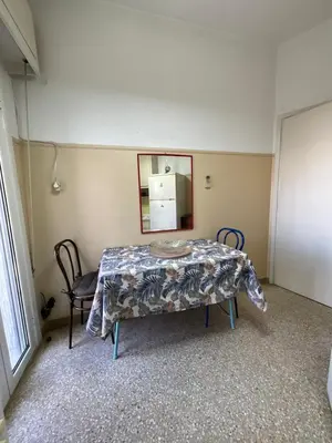 a room with a table and a mirror on the wall at The Kallimarmaro Nest in Athens