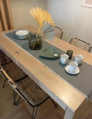 a table with plates and cups and a plant on it at Iris 2 Bedroom with Balcony in Pagkrati in Athens