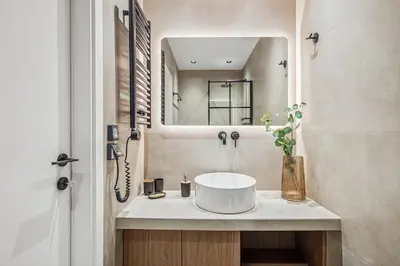a bathroom with a sink and a mirror at The Athens Luminous Suite in Athens