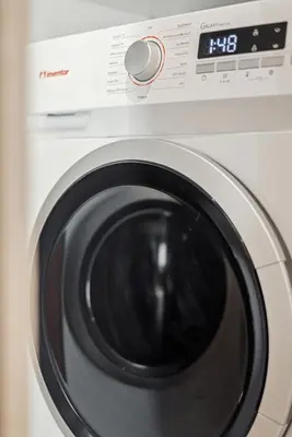 a close up of a washing machine at The Athens Luminous Suite in Athens