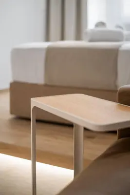 a white coffee table in front of a couch at The Athens Solstice Suite in Athens