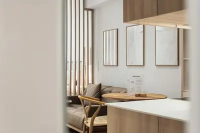 a kitchen with a couch and a table in a room at The Athens Edit Suite in Athens