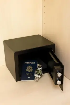 a box with a passport and a watch in it at Panormou Urban Getaway Next to Metro Fast Wi-Fi in Athens