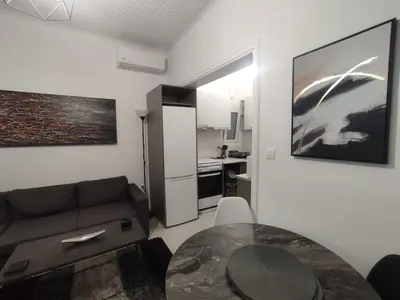 a living room with a couch and a table at Urban Cocoon, Nice & Easy in Athens