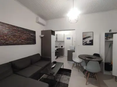 a living room with a couch and a table at Urban Cocoon, Nice & Easy in Athens