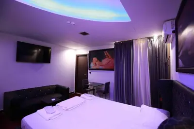 a purple room with a bed and a tv at Comfort Room 216 - Castle De Paris in Athens