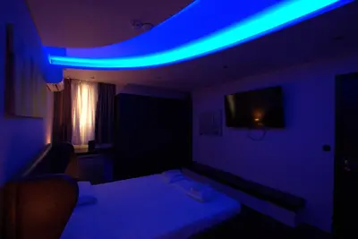 a room with a blue light on the ceiling at Comfort Room 218 - Castle De Paris in Athens