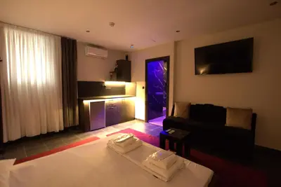 a living room with a bed and a couch at Deluxe Suite 212 - Castle De Paris in Athens