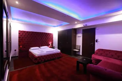 a bedroom with a bed and a couch at Deluxe Suite 213 - Castle De Paris in Athens