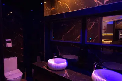a bathroom with two sinks and a toilet at Deluxe Suite 214 - Castle De Paris in Athens