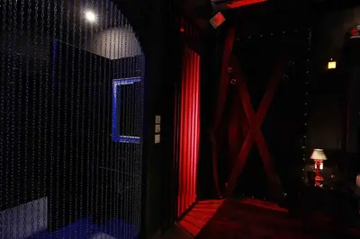 a room with red and blue lights on a wall at Experience Room 102 - Castle De Paris in Athens