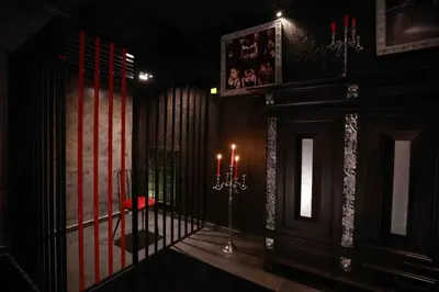 a room with a gate with two candles in it at Experience Room 103 - Castle De Paris in Athens