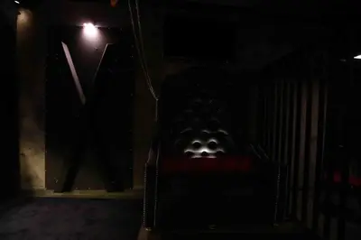 a dark room with a chair in the dark at Experience Room 105 - Castle De Paris in Athens