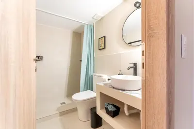 a bathroom with a sink and a toilet at A1 Porto Living in Piraeus