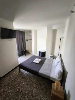 a bedroom with a large bed in a room at Athens Commercial Premium in Athens