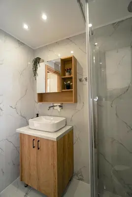 a bathroom with a sink and a shower at Athens City-Break Studios- near Acropolis in Athens