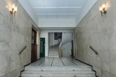 a hallway with stairs in an office building at Modern Studio Stay in Trendy Kolonaki in Athens