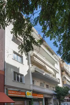 a white building with balconies on the side of it at Modern Studio Stay in Trendy Kolonaki in Athens