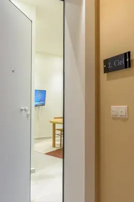 an open door in a room with a table at Ciel - Studio in Thisseio in Athens