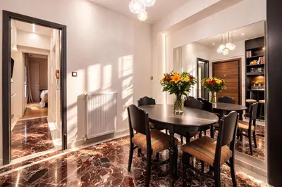 a dining room with a table and chairs at Luxurious Apartment at Hilton Area in Athens