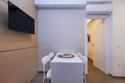 a dining room with a table with a cake on it at Lilly's House in Athens