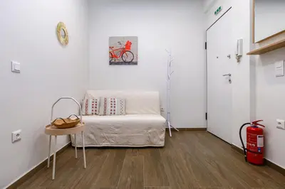 a room with a bed and a table in it at Lilly's House in Athens