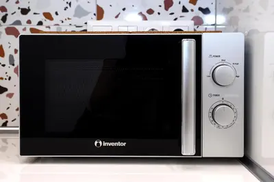a microwave oven sitting on top of a counter at Lilly's House in Athens