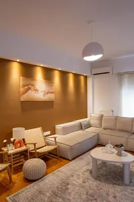 a living room with a couch and a table at E35 by SpitiSou in Athens