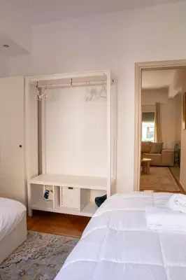 a bedroom with a large white bed and a window at E35 by SpitiSou in Athens