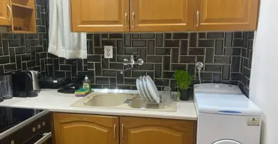 a kitchen with a sink and a counter top at The Exarcheia Nook Chic Renovated 2BR Apartment in Athens
