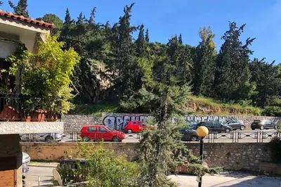 a group of cars parked in a parking lot at 4th Floor Bright 2BR Retreat Near Acropolis in Athens