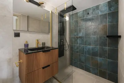 a bathroom with a sink and a shower at 4th Floor Bright 2BR Retreat Near Acropolis in Athens