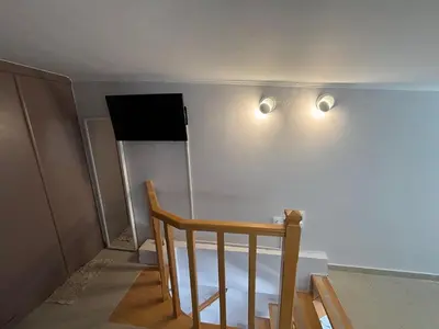 a room with a bed and two lights on the wall at mets in Athens