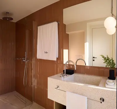 a bathroom with a shower and a sink and a mirror at Bellén Athens Ηotel in Athens