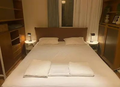 a bed with two pillows on it in a bedroom at Acropolis Vista 3-Bedroom in Neos Kosmos in Athens