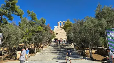 a group of people walking down a stairway at Heritage Retreat by Acropolis & Museum in Athens