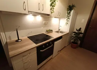a small kitchen with a sink and a stove at Heritage Retreat by Acropolis & Museum in Athens