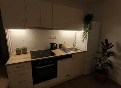 a kitchen with a sink and a stove top oven at Heritage Retreat by Acropolis & Museum in Athens